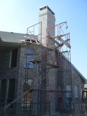 A building with scaffolding around it and a fire escape.